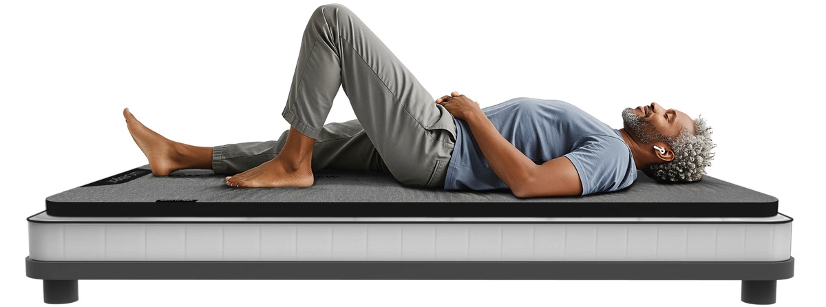 A man relaxing on the Woojer MAT