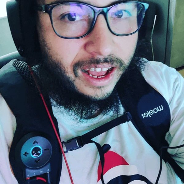 Woojer customer selfie wearing the unit over the shoulder