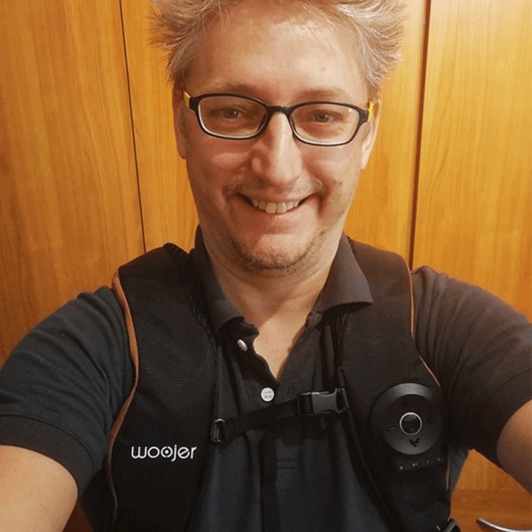 Customer wearing the Woojer Vest indoors