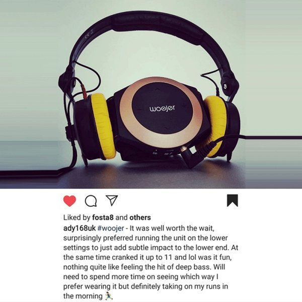 Woojer unit photographed with headphones, with the customer comment below