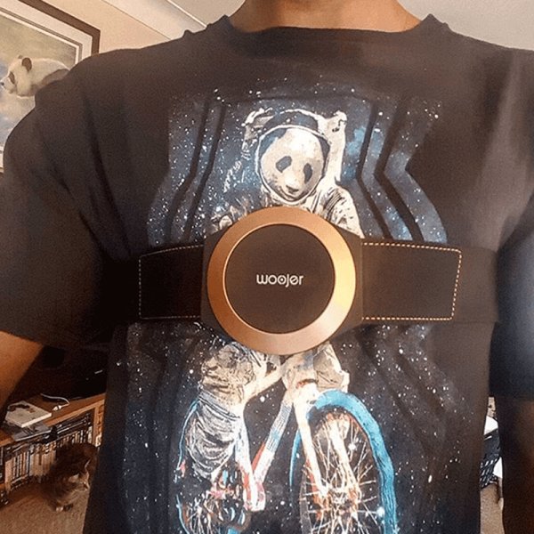 Woojer customer wearing the unit over a t-shirt