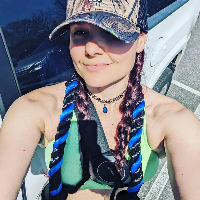 Woojer customer with braided hair wearing the unit