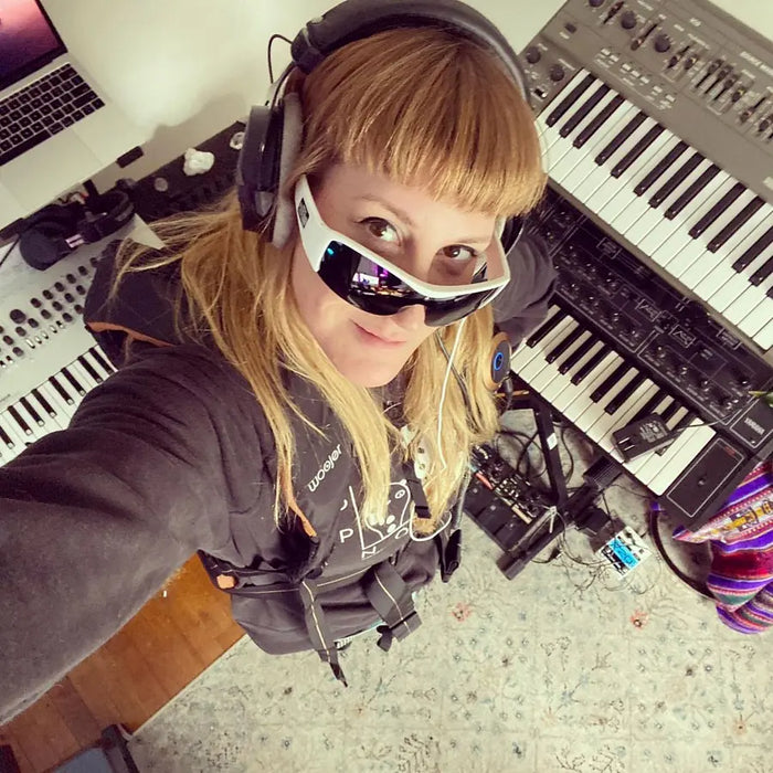 Woojer customer at a keyboard wearing the unit