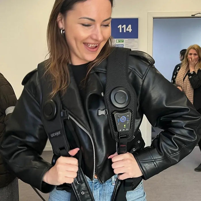 Customer wearing the Woojer Vest under a leather jacket