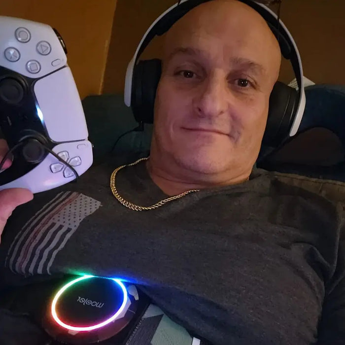 Woojer customer wearing headphones and the unit