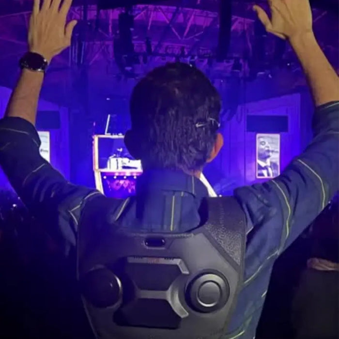 Customer wearing the Woojer Vest at a live show